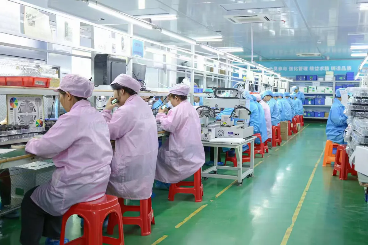 Staff and assembly workstations on an AUSEK camera production line