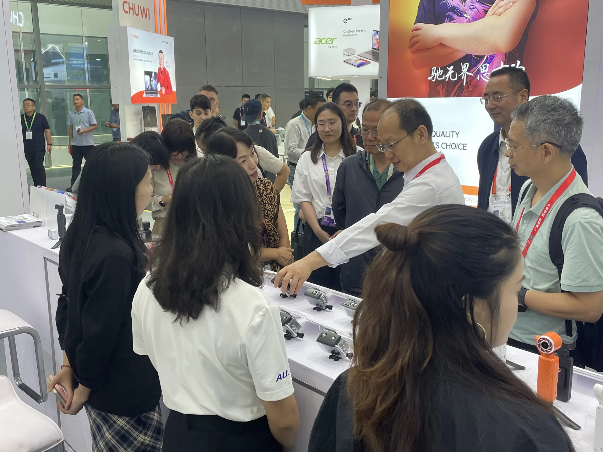 Visitors examining a sample at the booth.