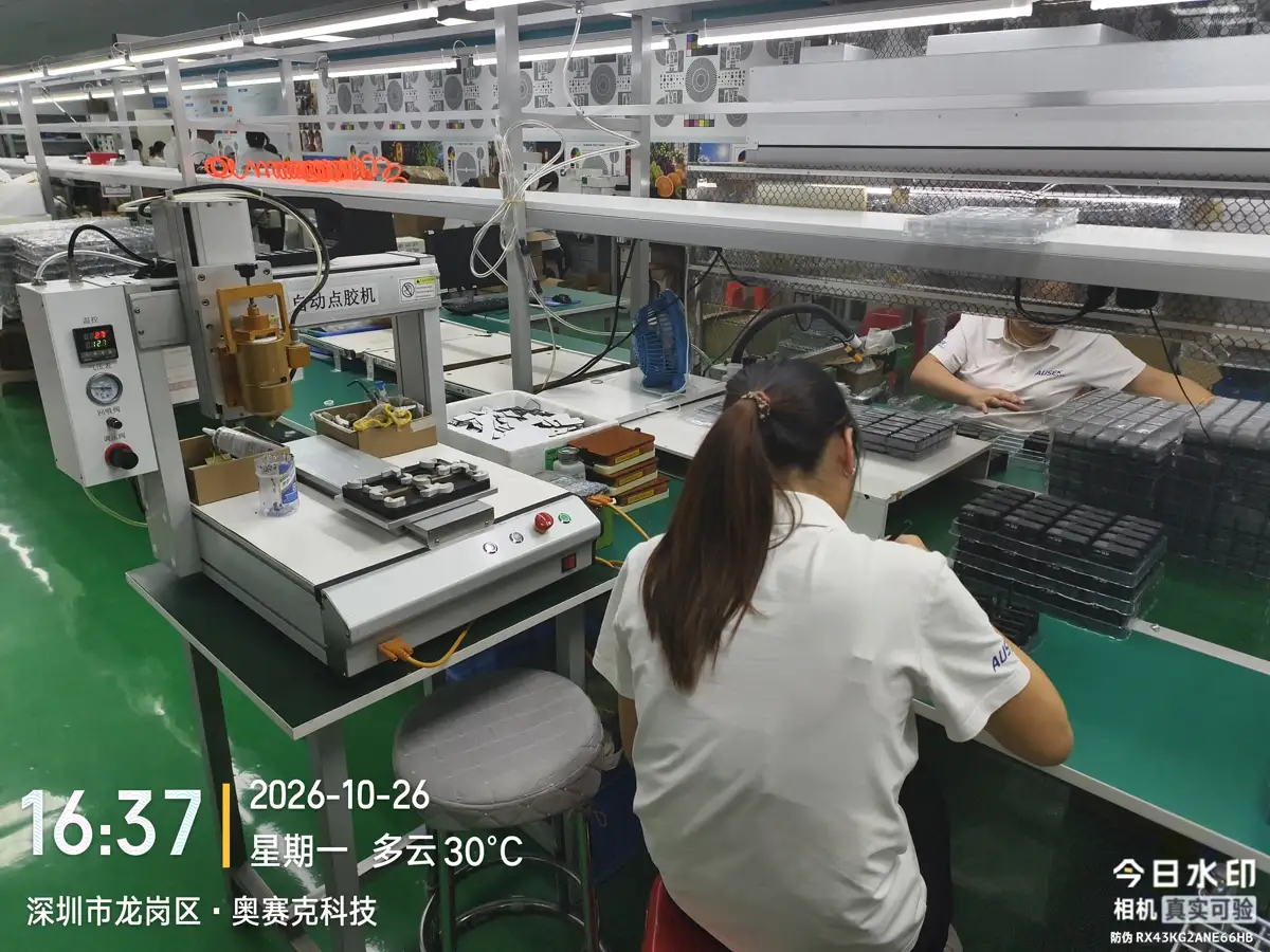 Automatic glue-dispensing equipment and adjacent assembly workstations, 26 October 2026.